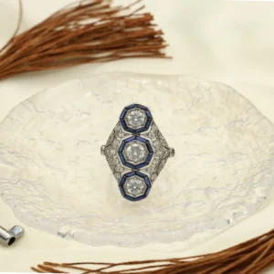 Lanzadera Art Déco de Platino con Zafiros blancos y Azules